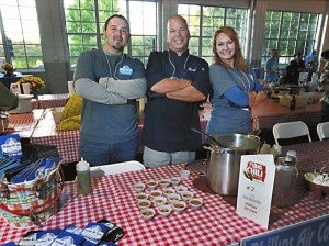 Phillips Air Care table:   Kelly Efird, Mike Johnson, and Ashley Efird at the Waterworks Chili Cook Off .  photo by Wayne Hinshaw, for the Salisbury Post