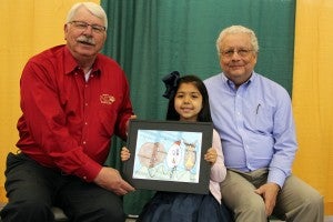 Adelisse Torres is pictured with Agriculture Commissioner Steve Troxler, left, and Jimmy Gentry, executive director of the N.C. State Grange.