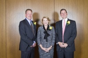 Appalachian State University Chancellor Sheri N. Everts, center, congratulates E. Hayes Smith, left, and his brother D. Kenan Smith, right, as recipients of the university's Outstanding Service Award during a recent Homecoming 2016 luncheon. The two Salisbury residents are business partners at Second Creek Development Co., and they are Appalachian State University alumni. Submitted photo