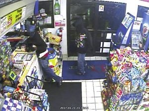 Surveillance footage from an armed robbery at DMart at 1600 S. Main St. on Saturday night at 9:38 p.m. Two suspects entered the store, pointed a gun at the clerk and had her walk to the counter. As he did this, a second clerk hit him in the back of the head with a beer can and the suspect fired the gun, grazing the clerk's arm. The suspect then grabbed the money out of the cash register and the two suspects ran from the store towards W. B Ave. The descriptions of the suspects are two black males, slim build,  age 20-30, around 5-foot-9.