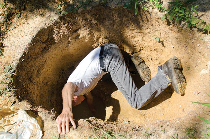 Man in the hole Sears has found what he was digging for — water