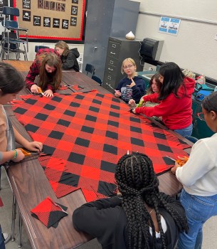 Warming up to others China Grove Middle club donates blankets to area